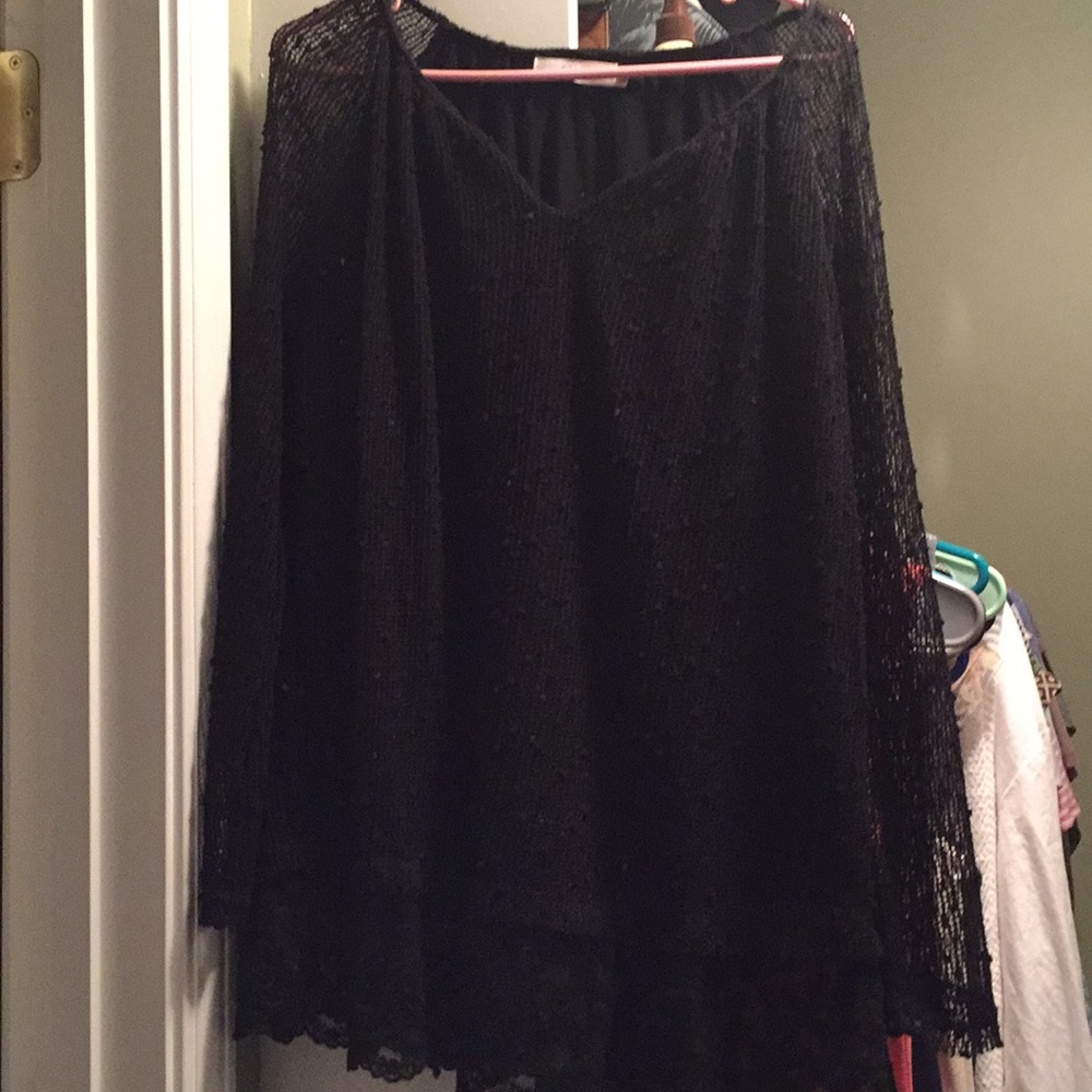 Black lacy blouse. Goes great with jeans size m